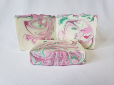 Sweet Pea Handmade Soap - Imagine an English garden resplendent with sweet pea, hyacinth, lily of the valley, violets, and wild jasmine.  Now imagine these scents surrounding you in your shower every morning.  You can enjoy this wonderful fragrance anytime with our Sweet Pea soap.  Ingredients:  Olive Oil, Coconut Oil, Organic Palm Oil (ethically and sustainably sourced), Water, Sodium Hydroxide, Shea Butter, Sweet Almond Oil, Meadowfoam Oil, Castor Oil, Fragrance, Kaolin Clay, Skin-Safe Colorants