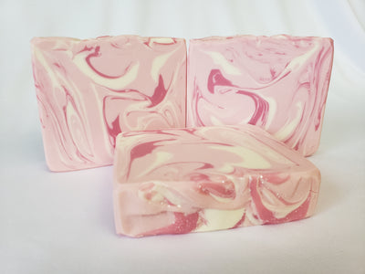 Strawberry Fields Handmade Soap - A juicy blend of fresh strawberries, white peaches, succulent mango, and rich vanilla beans.  Ingredients:  Olive Oil, Coconut Oil, Organic Palm Oil (ethically and sustainably sourced), Water, Sodium Hydroxide, Shea Butter, Meadowfoam Oil, Sweet Almond Oil, Castor Oil, Fragrance, Kaolin Clay, Skin-Safe Colorants