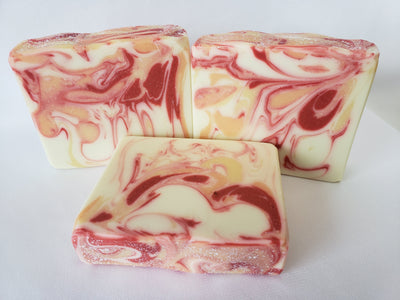 Apple Mango Handmade Soap - A fruity tropical pomegranate, melon, and apple - pear type with top notes of orange, grape, and green apple followed by middle notes of pineapple, cyclamen, lily of the valley, peach, and rose of jasmine.  A beautiful base of amber and musk complete this soap's lovely fragrance.