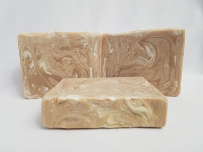 Caramel and Honey Handmade Soap -   A beautifully warm honey blush color with delicate white swirls perfectly reflect the creamy honey and sweet caramel scent of this soap.  Compare this scent to Lush's Honey I Washed the Kids.  Ingredients:  Olive oil, coconut oil, organic palm oil, water, sodium hydroxide, rice bran oil, sweet almond oil, meadowfoam oil, caster oil, fragrance, kaolin clay, skin-safe colorants